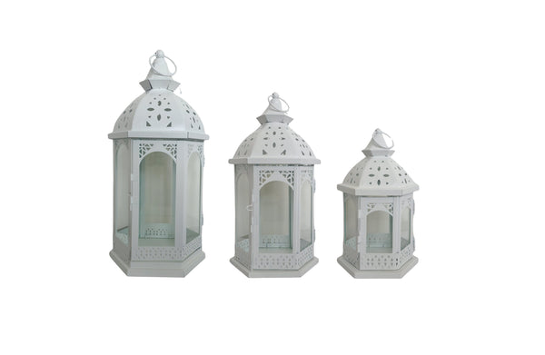 White Metal Lantern Set of 3 – intricately designed lanterns in small, medium, and large sizes with glass panels and arched cut-outs