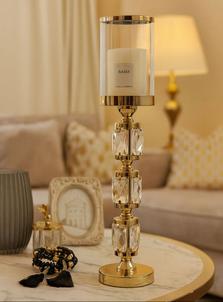 Decorative table gold candle holder with crystals on a living room table