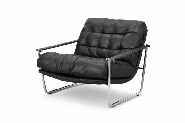 Archer tufted arm chair in black vegan leather with chrome frame and modern low profile design.