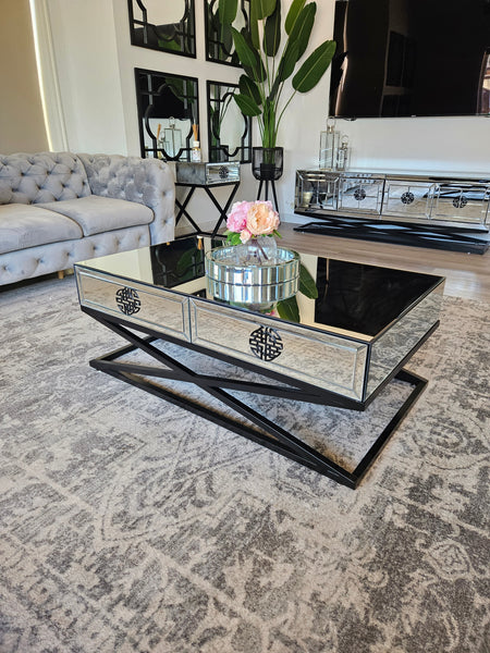 Mirrored Athens coffee table with decorative tray, showcased in elegant contemporary living room setting.
