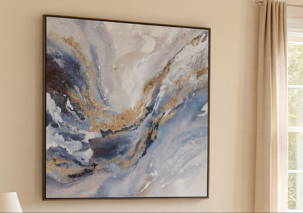 Abstract painting with blue, gold, and white tones on a beige wall.