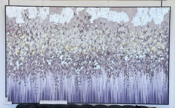 Oversized silver and earthy-toned abstract forest canvas with black wood frame, mounted above a sofa.