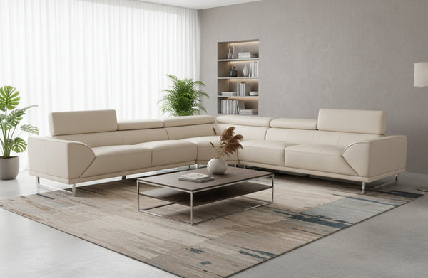 Brighton cream leather corner lounge styled in modern living room with rug, plants, shelving and soft lighting.