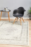 Century 977 Silver Rug styled in a modern living room with a black chair and side table.