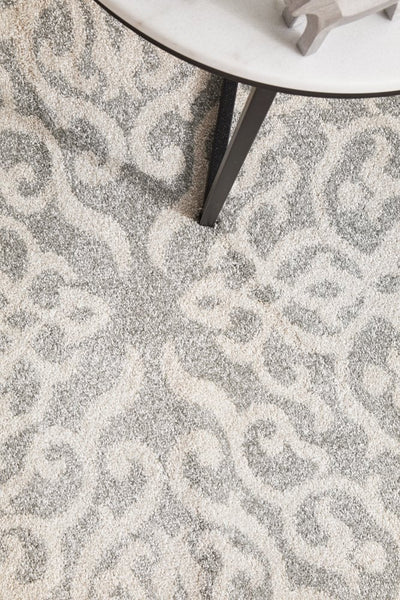 Close-up of Chrome Lydia Silver Rug detail under side table