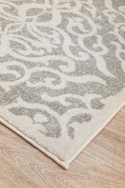 Corner view of Chrome Lydia Silver Rug highlighting border
