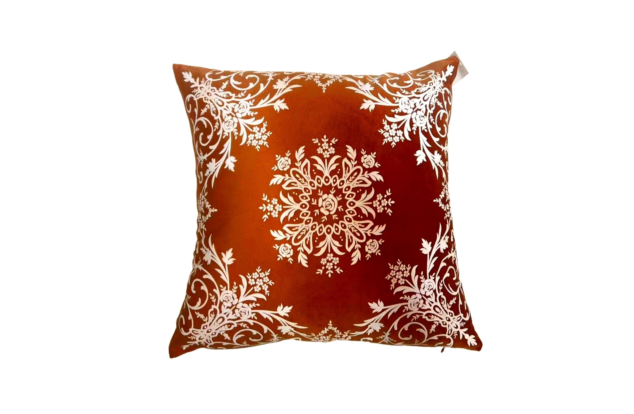 Bold burnt orange damask velvet cushion with ornate floral design, perfect for striking home accents.