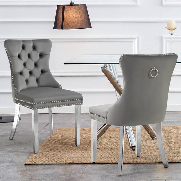 Elegant Alsea dark grey velvet dining chairs with silver legs styled in a dining space