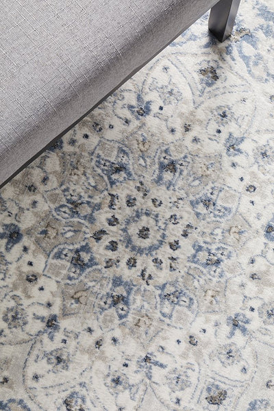 Close-up of Emotion 77 Blue Rug central floral medallion detail