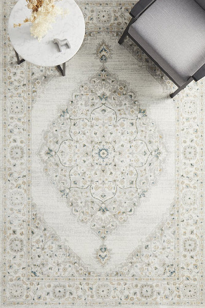 Top view of Emotion 77 Green Rug under modern furniture setup – showcases symmetrical medallion design and muted green hues