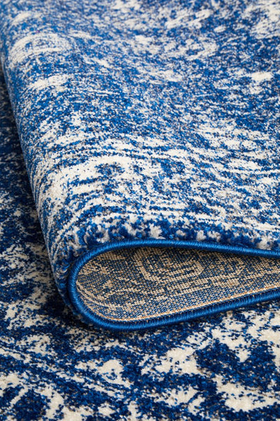 Rolled edge of Evoke 252 Navy Rug showing durable polypropylene weave