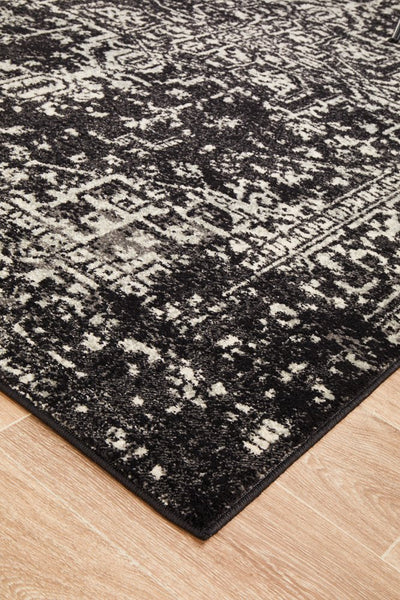 Corner view of Evoke Charcoal Rug showing border and pattern