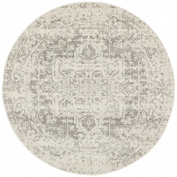 Full top view of round white silver rug with ornate pattern