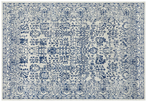 Traditional ivory rug with navy distressed floral motifs, perfect statement piece for classic home interiors.