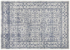 Classic ivory rug with navy floral motifs, detailed distressed pattern ideal for elegant interiors.