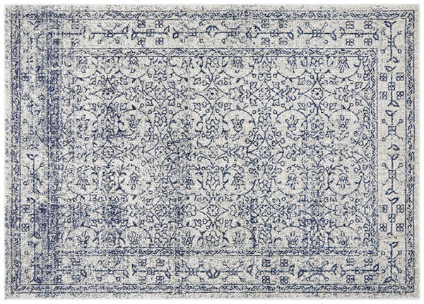Classic ivory rug with navy floral motifs, detailed distressed pattern ideal for elegant interiors.