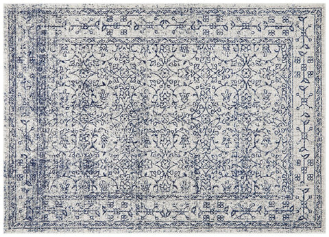 Classic ivory rug with navy floral motifs, detailed distressed pattern ideal for elegant interiors.