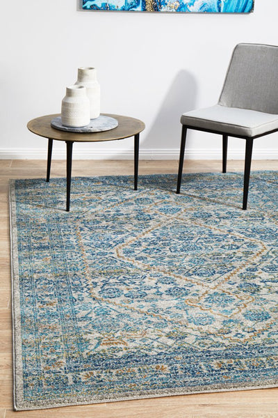 Evoke 263 Silver Rug styled with modern chair and round coffee table in living space