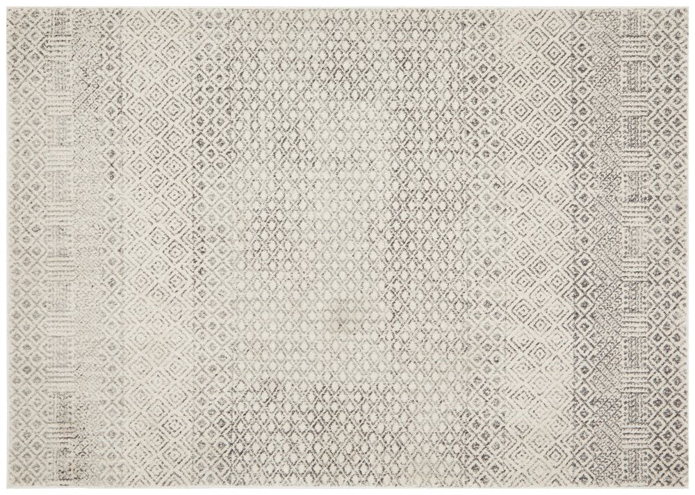 Evoke 265 Grey Rug flatlay showing full geometric distressed pattern in silver and grey.