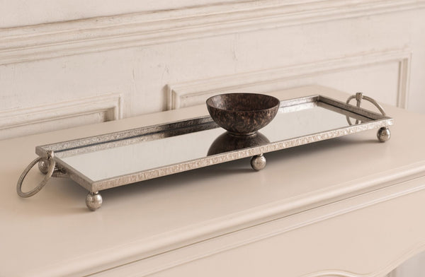 Decorative mirror silver tray with a bowl on a white surface