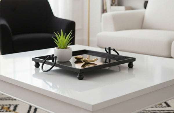 Black Square Mirror tray with a plant on a white coffee table in a living room setting