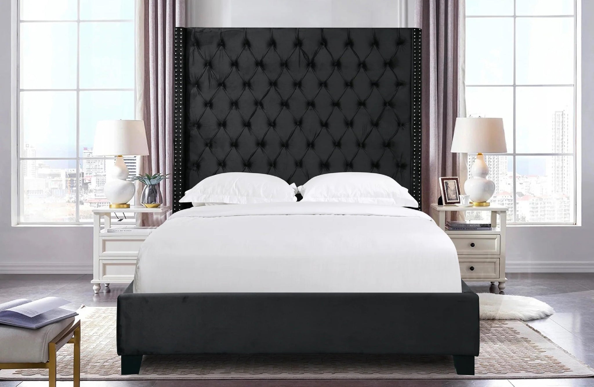 Ella Winged Bed in black velvet styled in a modern bedroom interior.