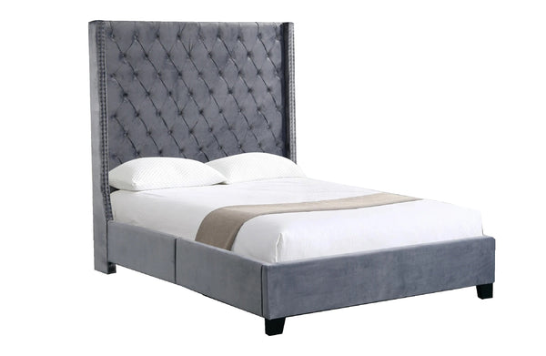 Side angle view of Ella Winged Bed in grey velvet with diamond-tufted headboard.