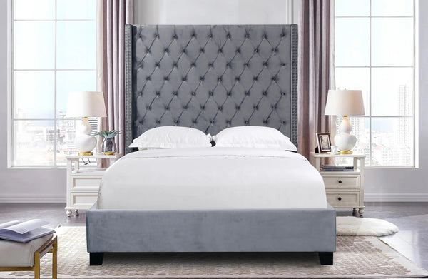 Ella Winged Bed in grey velvet styled in a contemporary bedroom interior.