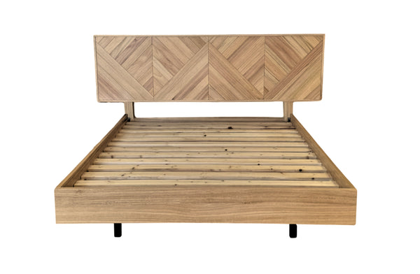 Esta herringbone floating bed frame crafted from natural messmate timber with patterned headboard.