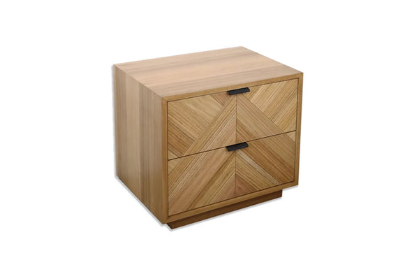 Esta herringbone floating bedside table crafted from natural messmate timber with two storage drawers.