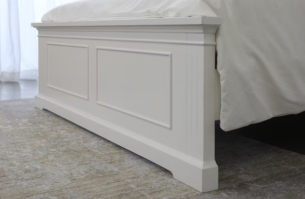 Close-up view of the Hamptons white bed footboard showcasing panel detailing and coastal design.