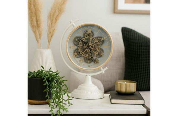 Decorative Mechanical Gear freestanding clock on a shelf with plants and candles