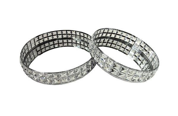 Set of 2 silver round trays with crystal accents and mirrored bases, available in small and large sizes.