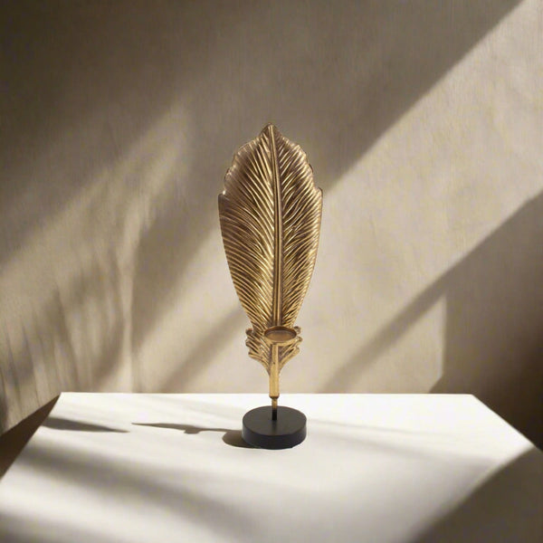  Leaf Table Décor in Gold placed on a white table in a warmly lit interior – artistic centerpiece with textured metallic finish and natural elegance