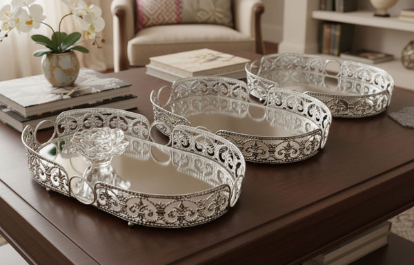 Decorative silver oval trays on a wooden table with a home interior background