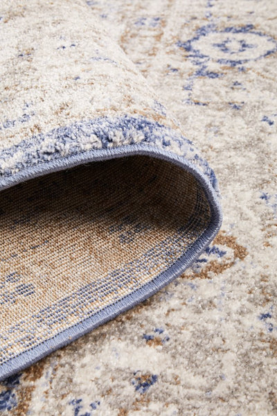 Folded corner of Mayfair Hugo Ocean Rug showing weave and backing