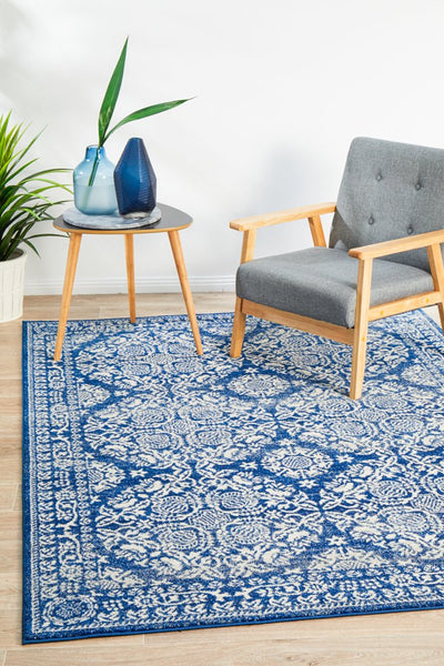 Mirage 358 Navy Rug styled in a bright modern living space