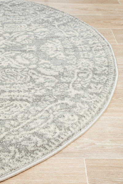 Close-up edge of round Mirage 358 Silver Rug with silver floral pattern
