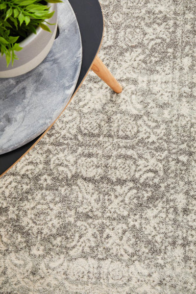 Detailed top view of Mirage 358 Silver Rug showing ornate silver and off-white floral motifs.