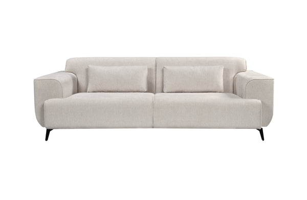 Front view of a light beige 3-seater fixed sofa featuring soft fabric upholstery, black tapered metal legs, and two elongated matching cushions.