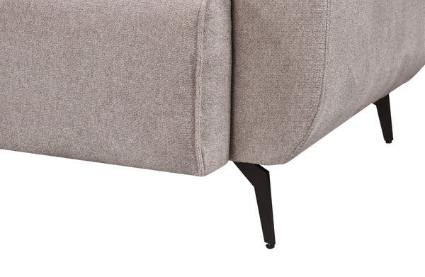 Detailed side view of the Maddox Lounge Sofa leg featuring a matte black metal finish and textured beige fabric upholstery, showcasing its clean seam and modern tapered support.