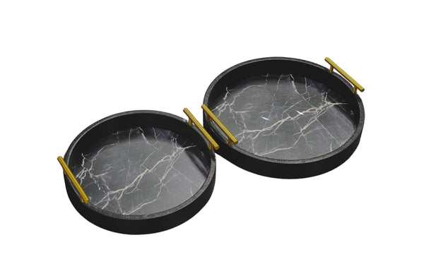 Set of two black round trays with faux marble base and gold handles, medium and small sizes.