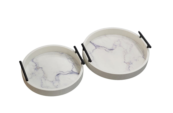 Set of two white round trays with faux marble base and gold handles, medium and small sizes.