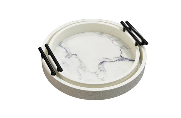 Stacked white round marble trays with gold handles, featuring faux marble base in medium and small sizes.