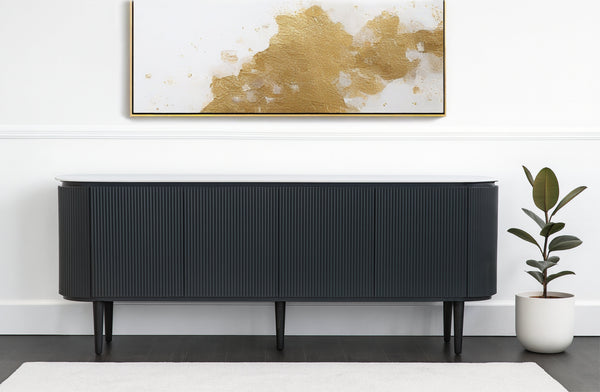 Miles ripple black TV unit styled in modern living room with artwork and indoor plant
