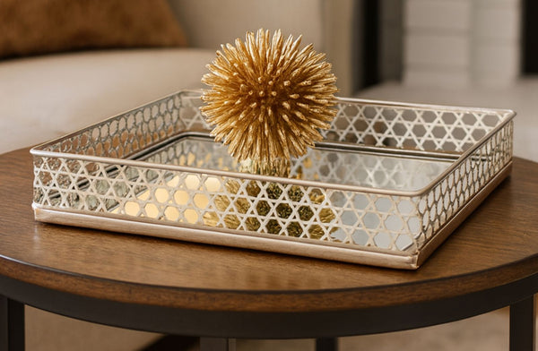 Decorative rectangle silver tray with geometric pattern on a wooden surface