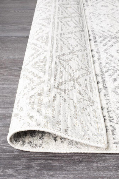 Folded edge of Oasis Grey Rug showing soft pile and weave