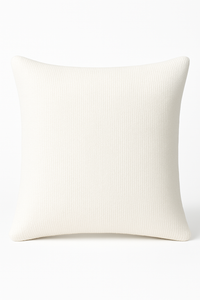 Plush luxury cushion crafted from cream boucle fabric shown against a plain white background.