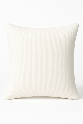 Plush luxury cushion crafted from cream boucle fabric shown against a plain white background.