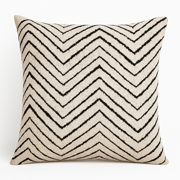 Reese luxury cushion featuring bold black chevron pattern on textured woven fabric.